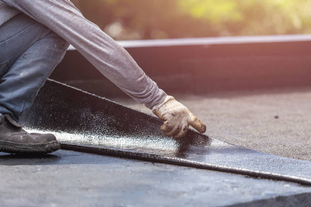 Professional Basement Waterproofing technician working in Henryville, IN